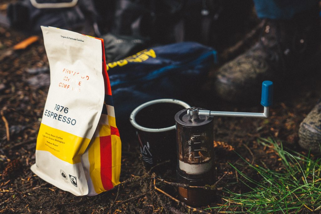 A picture of coffee fixings on a beach